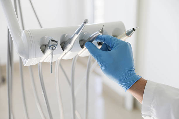 Professional Tooth Extraction technician working in Larkspur, CA